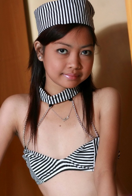 18 year old Asian girl showcases her natural pussy after removing her outfit 40229329