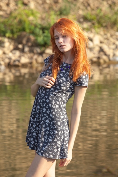 Sexy redheaded teen poses her thin body in the nude by a stream 43898221