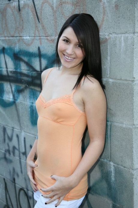 Young brunette Haylee Heart tugs on a hard cock while on her knees 12785409