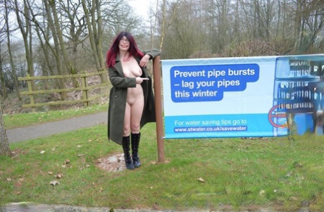 Sexy redhead mature BarbySlut spreading naked outdoors in coat  boots