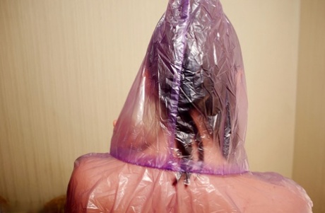 Long legged amateur covers up her naked body with a see thru rain jacket 79562889