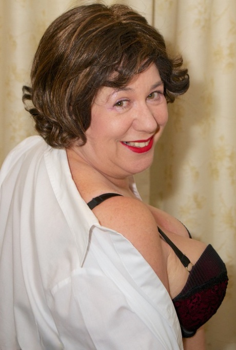 Mature woman Speedy Bee takes a riding crop to her vagina while disrobing 86181043