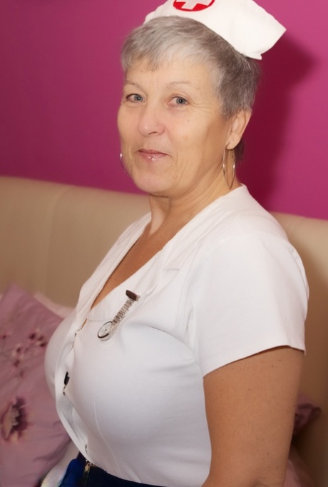 Mature nurse Savana takes off her uniform and lingerie in white stockings 11525094