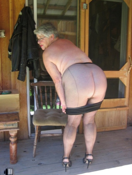 Obese nan Girdle Goddess unleashes her saggy boobs as she disrobes to hose 12285505