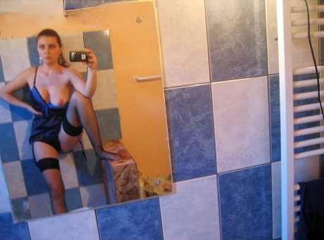 Redheaded girl Lory shows her natural tits while taking mirror selfies 50237145