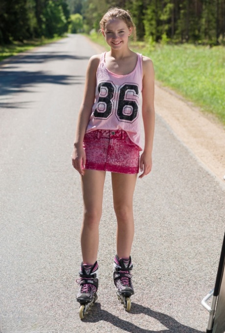 Young blonde girl Faina gets naked in middle of road wearing roller blades 63272591