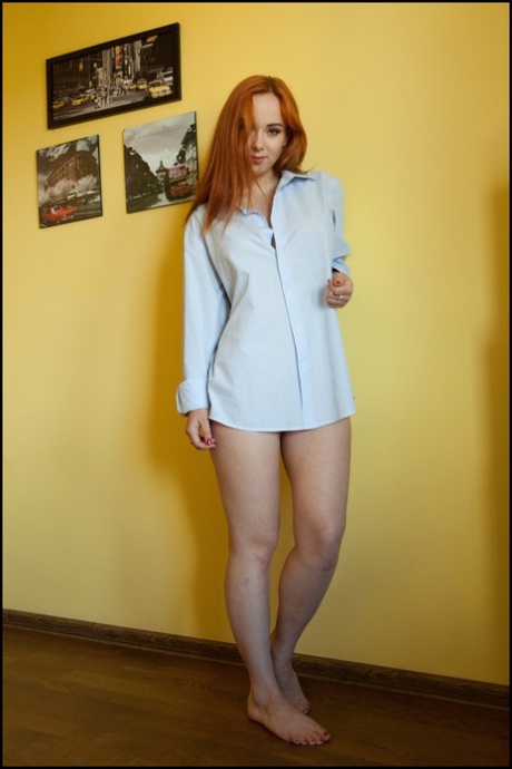 Beautiful redhead Lilli Lovey finger spreads her tight slit after going nude 77272987