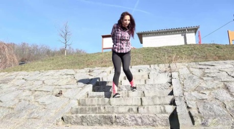 Caucasian girl Antonia Sainz pauses to pee on a flight of stone steps 31611031