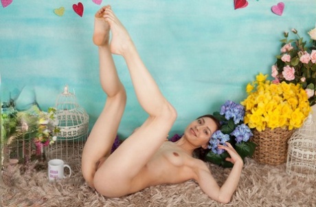 Charming young girl Raisa blows a kiss before getting totally naked 44884041
