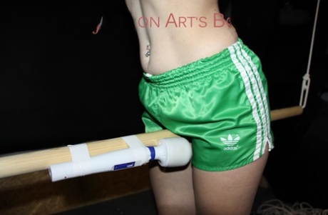 White girl has a vibrator applied to her cunt while restrained in nylon shorts 23516729