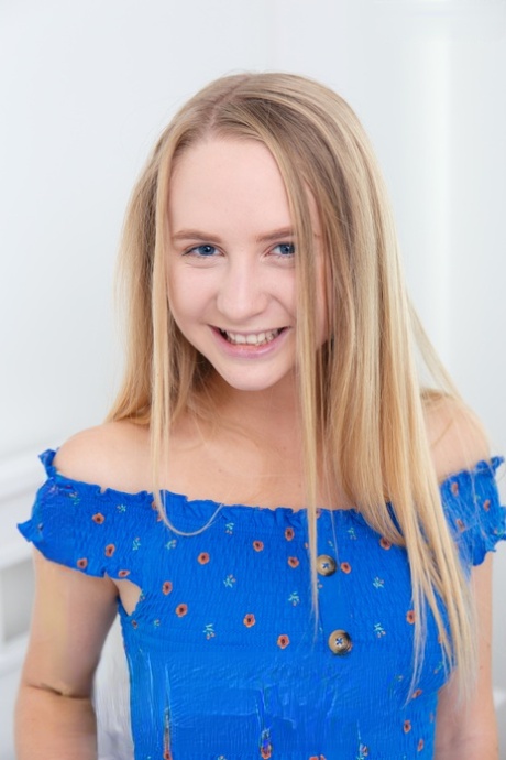 Young looking blonde Layza shows off her tan lined figure while naked on a bed 91877773