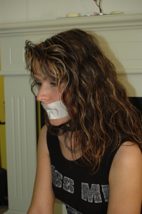 Clothed girl rips the tape off her mouth while in handcuffs 54259690
