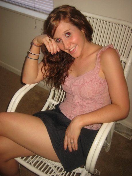 Redheaded teen gets completely naked on a chair during a solo performance 53150521