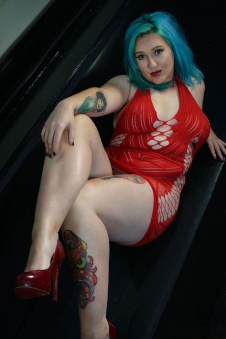 UK pornstar Ruby Fall lets her nipples slip free from a revealing red dress 76128963