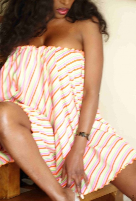 Ebony female displays her bare legs during non-nude action at home 34286164