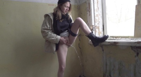 Nastya takes a badly needed piss inside an abandoned building 72375821