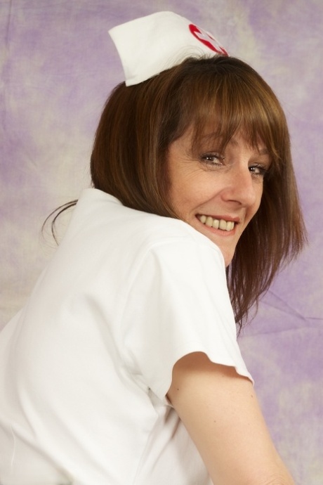 Mature nurse Dirty Doctor shows her thong during upskirt play 51057427