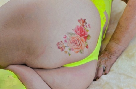 Blonde granny Sparkle looses her saggy tits from neon lingerie 67889870