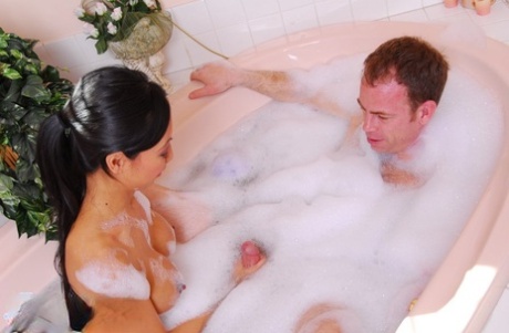 Slutty asian masseuse has some soapy cock jerking fun with her client 40636302