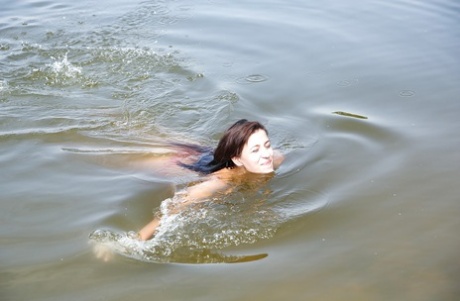 Wet teen babe Cindy T removing panties to pose nude outdoors on beach 52575814