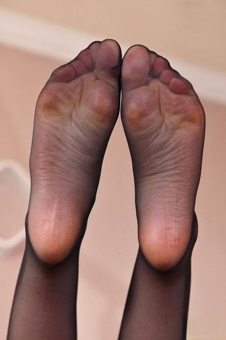 Leggy babe Stella Cox freeing barefeet from stockings and high heels 81032105