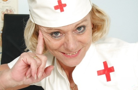Curvaceous granny in nurse uniform masturbating her gloryhole 85166622