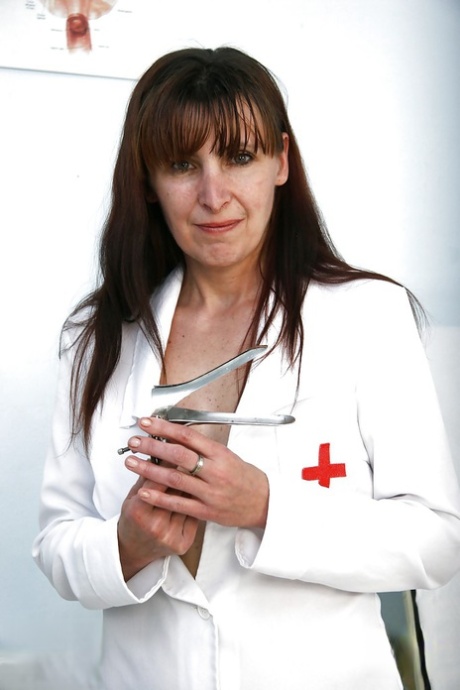 Naughty mature nurse in stockings exposing her shaggy twat 59319440